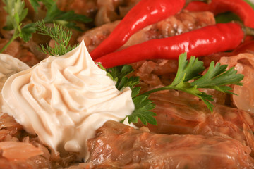 Sarmale traditional Romanian dish with cream and hot pepper