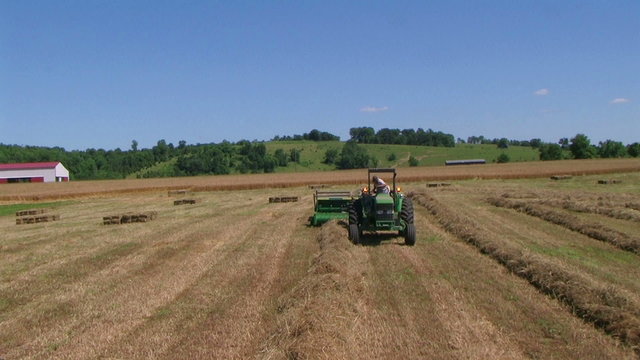 Farmer Baling Hay