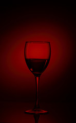 Fototapeta na wymiar glass of red wine on black background