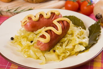 Sauerkraut with sausages, traditional german meal
