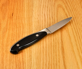 Paring Knife on wooden table