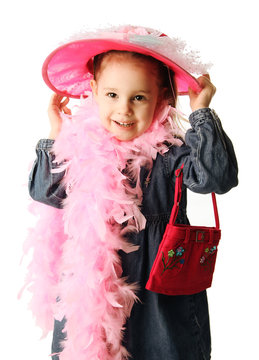 Preschool girl playing dress up