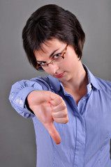 Business woman thumbs down isolated on white