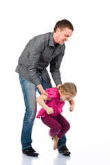 A young father and daughter playing