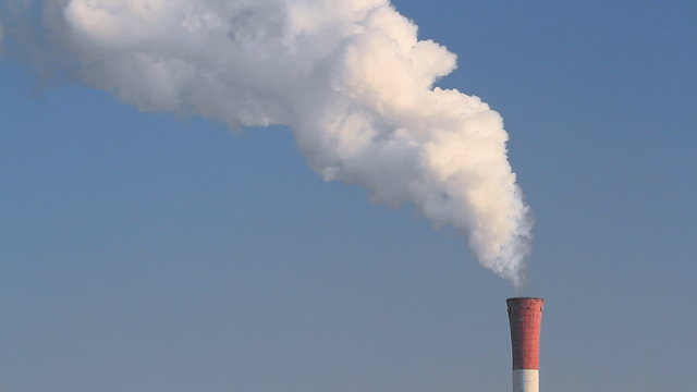 Smoke from a chimney on polluting the environment