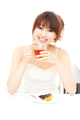 a portrait of beautiful asian woman drinking a cup of tea