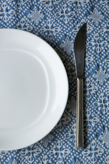 white plate and knife