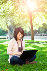 Mixed race college student with laptop