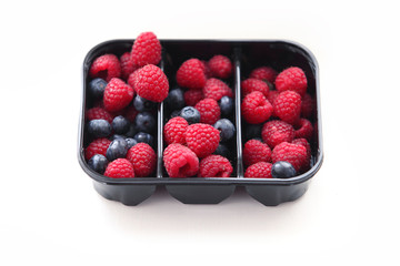 Raspberry and blueberry in packing