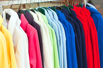 multicolor sport shirts hanging in store