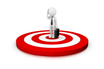 Confused businessman on a big target