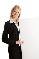 Cheerful businesswomen presenting empty board