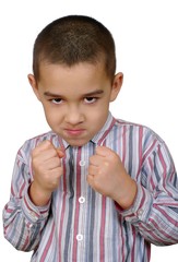Boy with fists raised ready to fight, isolated