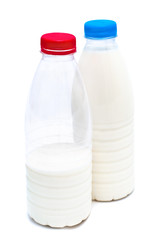Two white plastic bottles with milk