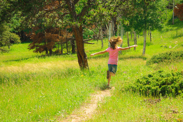 Girl Running Through Meadow