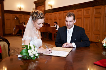 Happy bride and groom on solemn registration of marriage