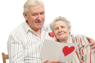 happy old couple with post-card