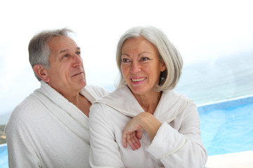 Portrait of happy senior couple in spa center