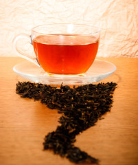 Tea cup with dry ted leaves