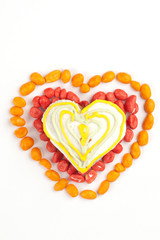 Heart made with gingerbread and dragees of peanuts