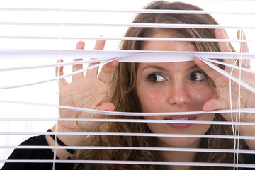 hands apart on the window blinds