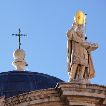 A cross and sclupture of st. Blasius (Sveti Vlaho) atop the Chur
