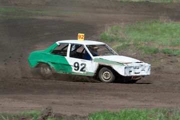 Obraz na płótnie Canvas Race for survival. Green white car