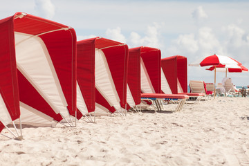 Colorful umbrellas and cabanas in popular South Beach in Miami