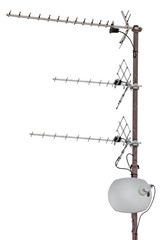TV and communication aerials on residential house roof, isolated