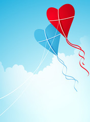 Obraz na płótnie Canvas two Hear-shaped kites in the sky