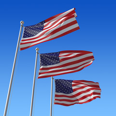 Obraz premium Three flags of USA against blue sky.