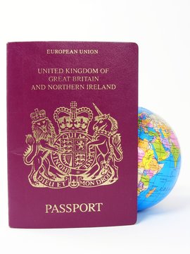 A passport with a globe inside on white background