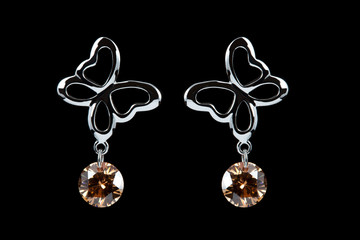 colored earrings on black