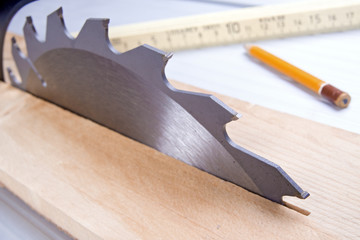Circular saw cutting wooden plank ..