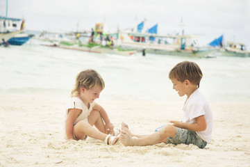 two children playing on beach