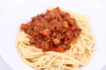 Spaghetti bolognese on a plate on a white background