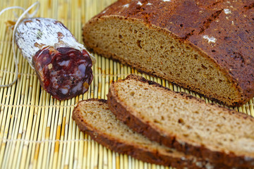 Salami sausage with homemade whole wheat bread sliced