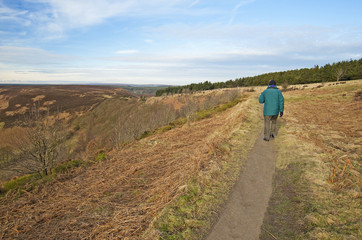 Obraz na płótnie Canvas Man walking through the countryside