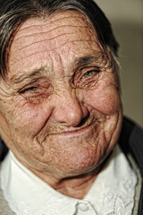 Closeup portrait of elderly happy woman smiling