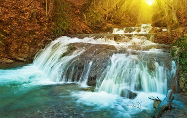 Fototapeta na wymiar Winter waterfalls in mountains.