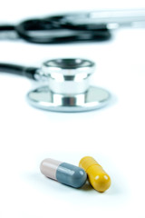 Capsule pills and a stethoscope