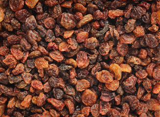 Dried red raisins, natural horizontal background