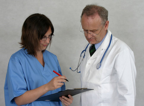 Nurse And Doctor Reviewing Notes