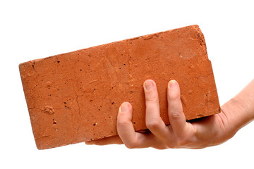 Old red brick in hand