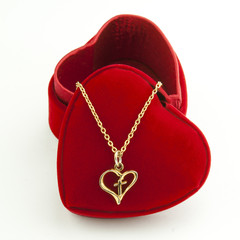 Necklace and heart shaped red box