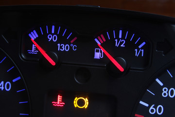 car fuel and temperature gauge in red and blue