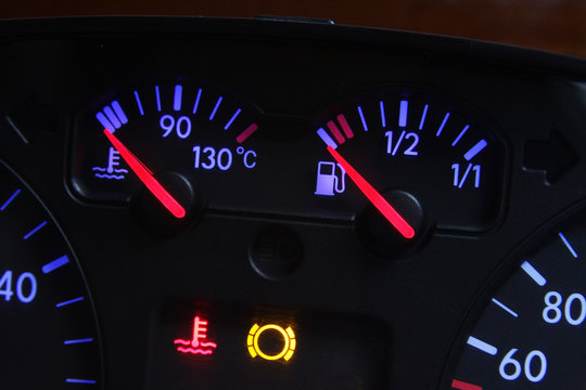 car fuel and temperature gauge in red and blue