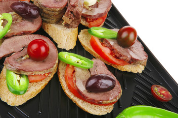 black teflon grill plate with meaty tartlets