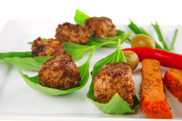grilled cutlets on basil leafs