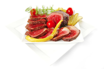 meat chunk and slices on plates